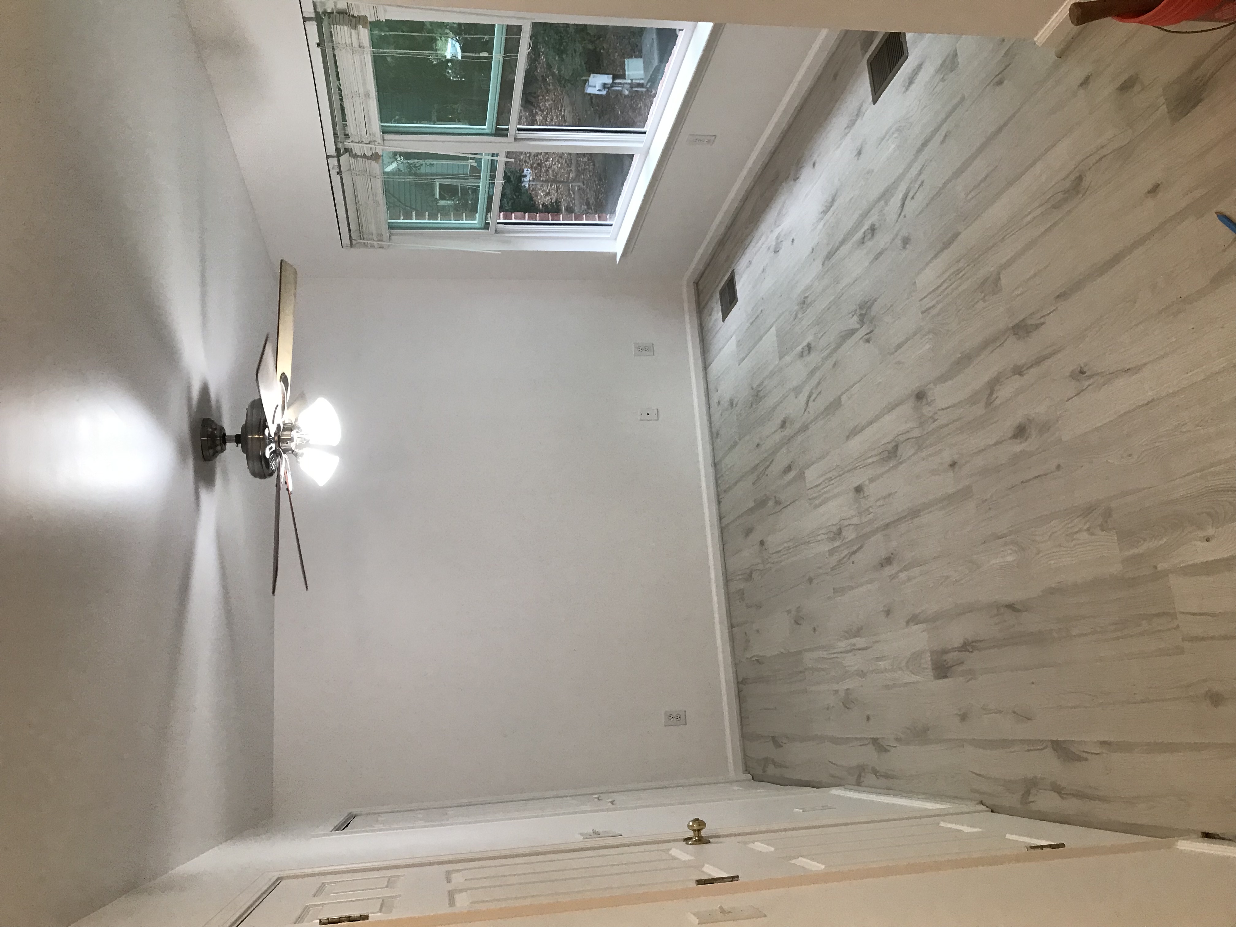 Satin walls and ceiling. Muted tongue and groove floors.